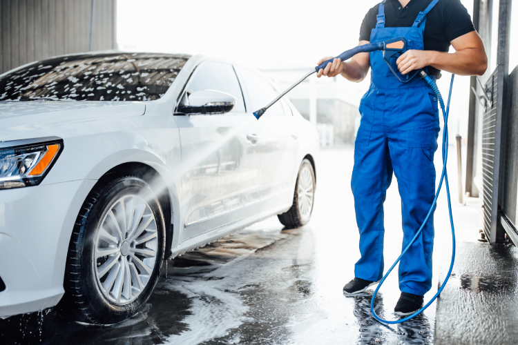 Image of a man washing car
